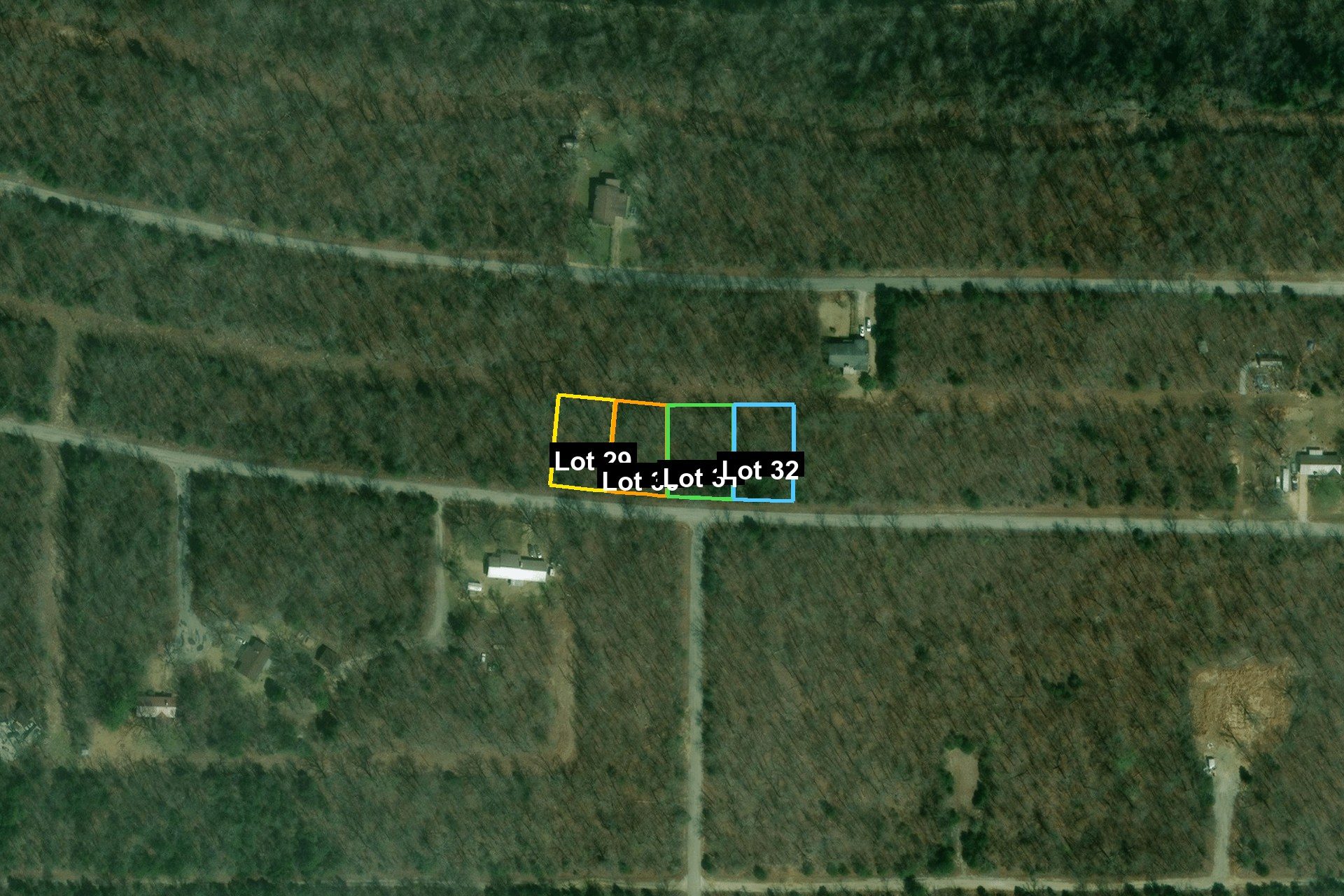 Aerial boundary view of all four connected lots (29–32) with individual colored outlines, 1.13 acres total